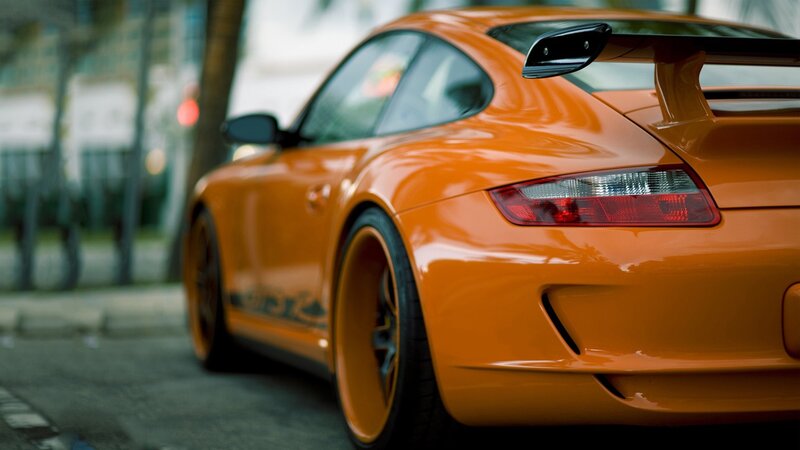 orange sports car rear view