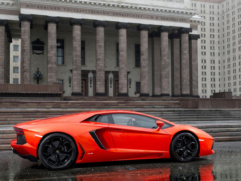 Orange Sports Car — Red, Dramatic, Photograph, Building, Steps
