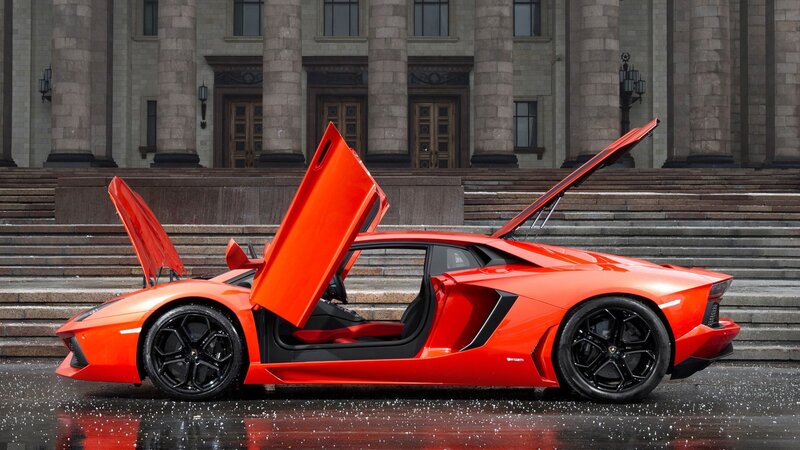 Orange Sports Car — Red, Dramatic, Photograph, Building, Steps, Wet Pavement