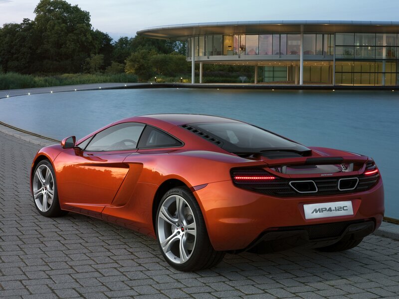 Orange Sports Car — Red, Serene, Sunset, Photograph, Building