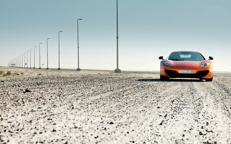 Orange Sports Car — Serene, Afternoon, Photograph, Desert Road