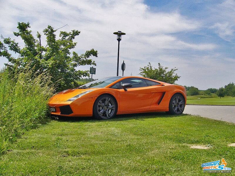 Orange Sports Car — Serene, Afternoon, Photograph, Grass, Trees