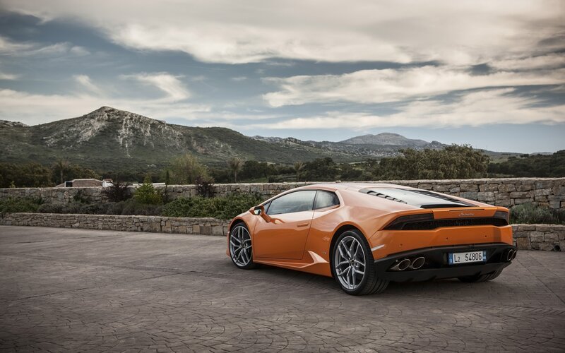 Orange Sports Car — Serene, Afternoon, Photograph, Mountains