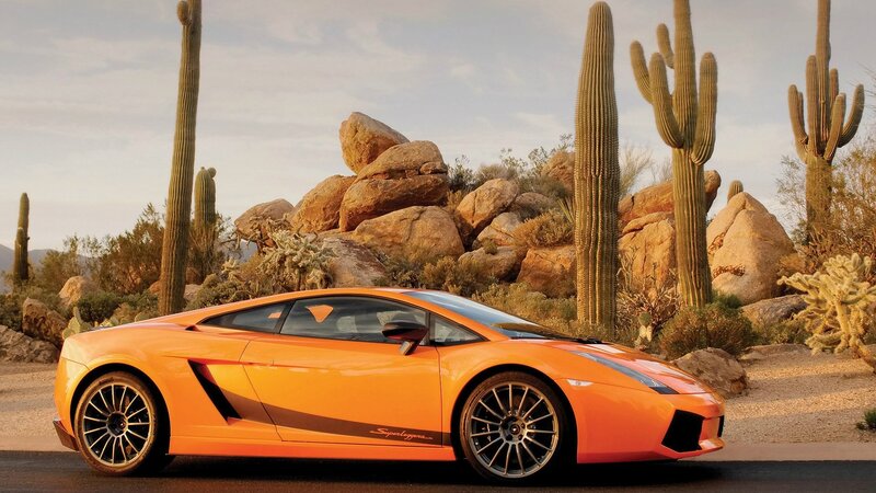 Orange Sports Car — Serene, Sunset, Photograph, Cactus, Rocks