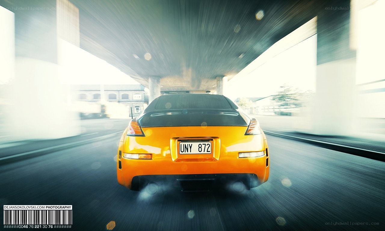 Orange sports car speeding
