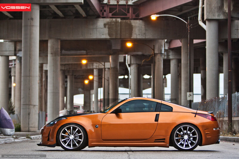 Orange sports car under overpass