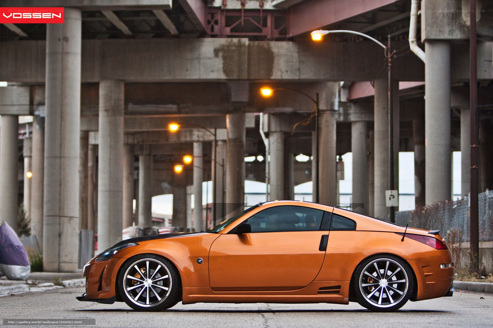 Orange sports car under overpass