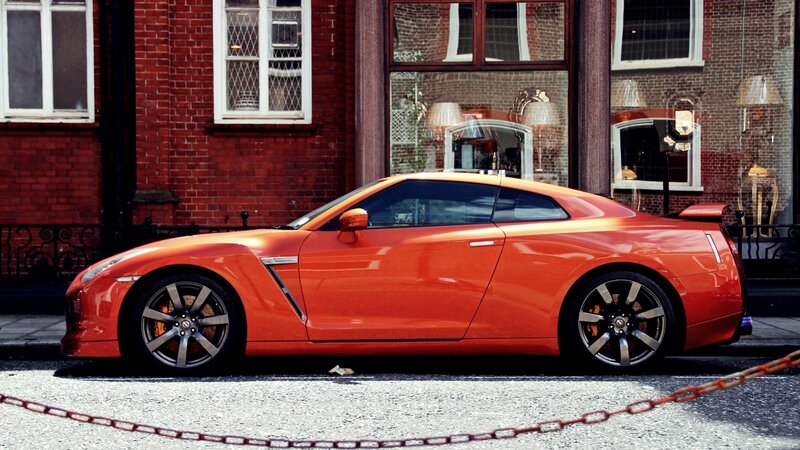 Orange Sports Car — Urban, Afternoon, Photograph, Brick Building