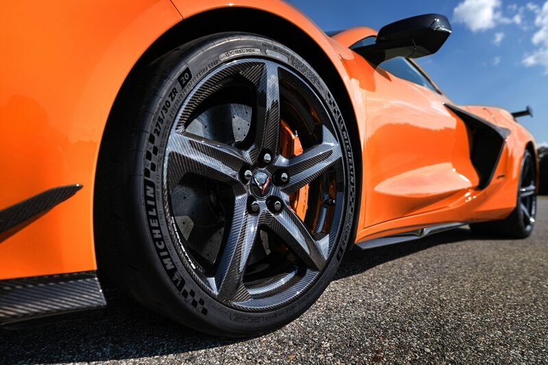 Orange Sports Car Wheel — Dramatic, Afternoon, Photograph, Tire