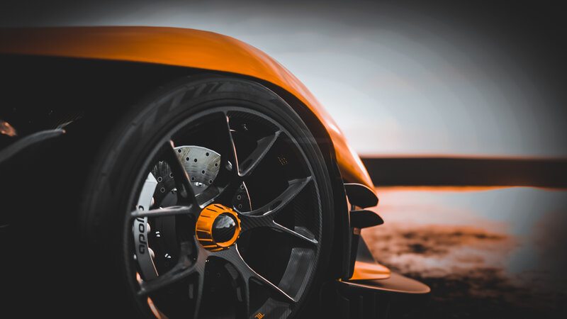 Orange Sports Car Wheel — Dramatic, Sunset