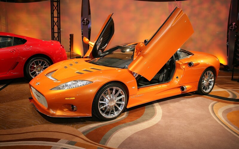 Orange sports car with doors open