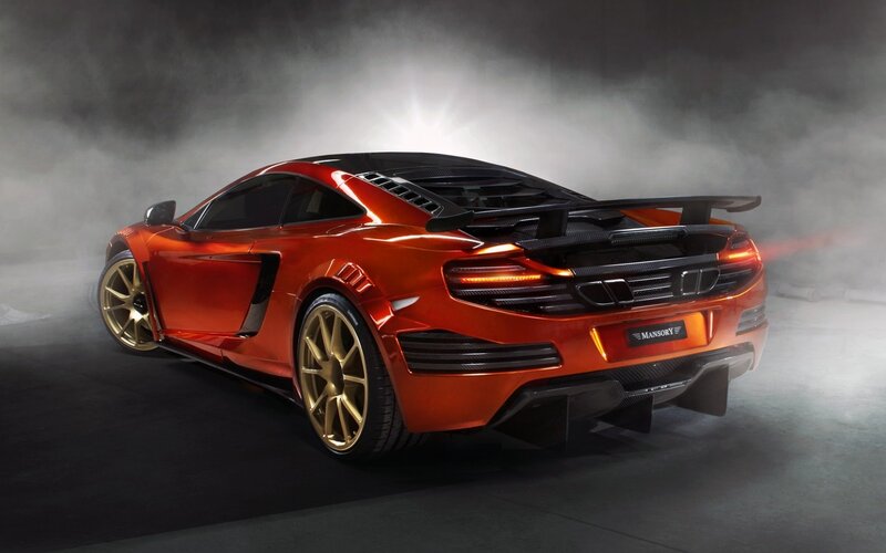 orange sports car with gold wheels