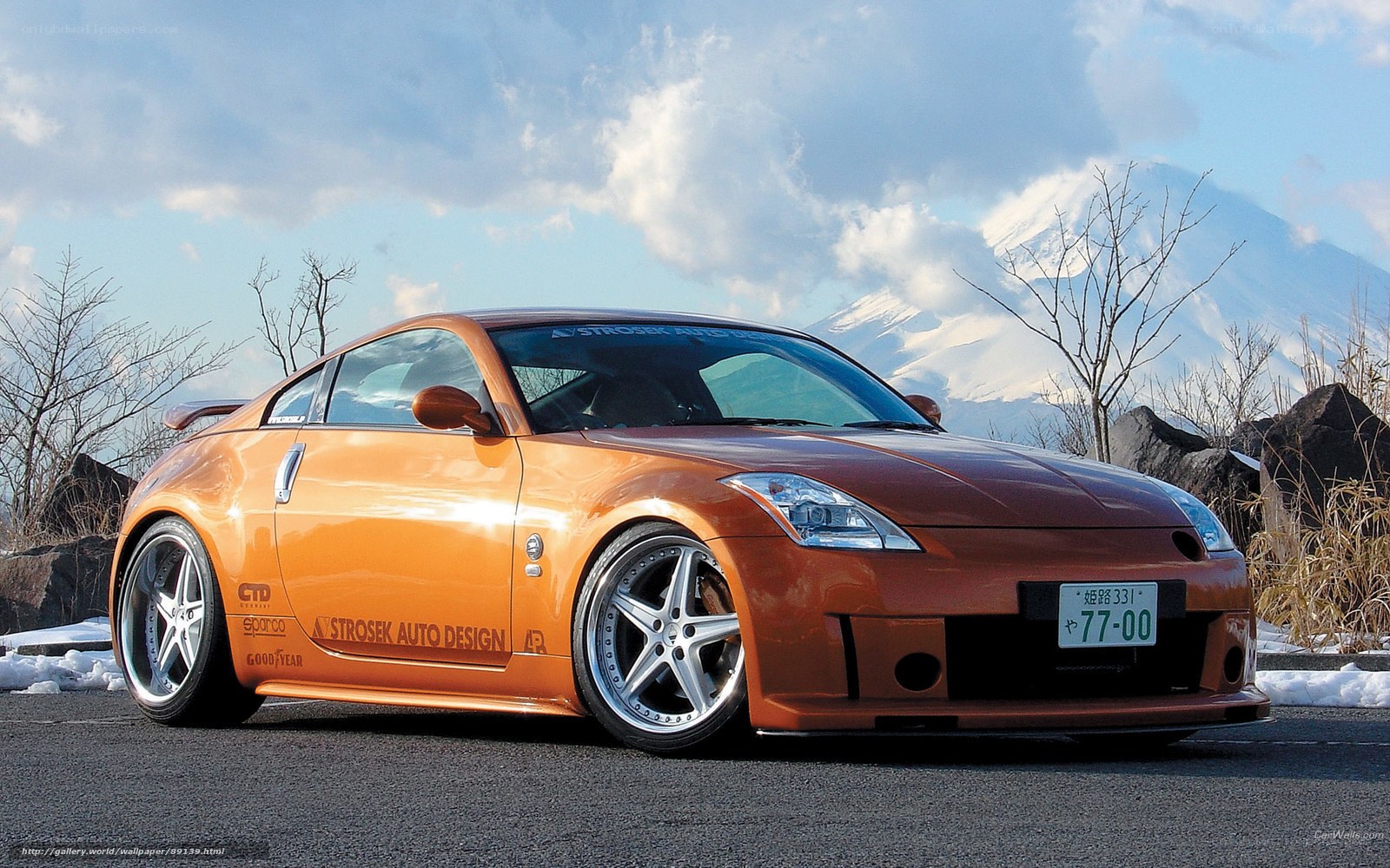 Orange sports car with mountain view