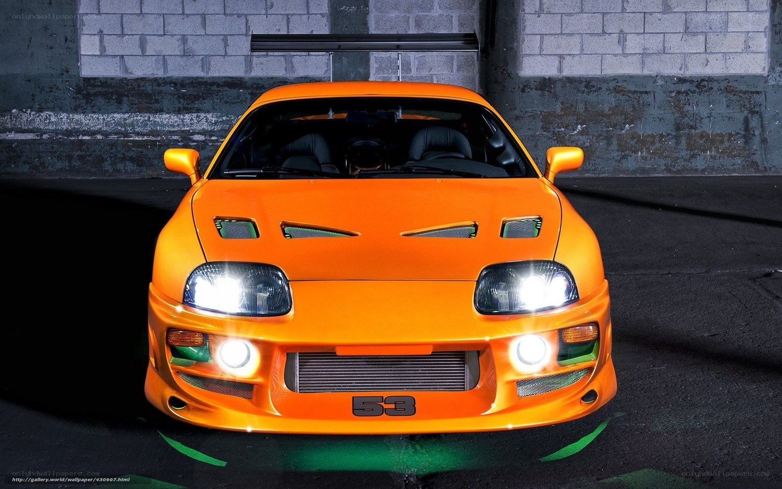 orange sports car with number 53