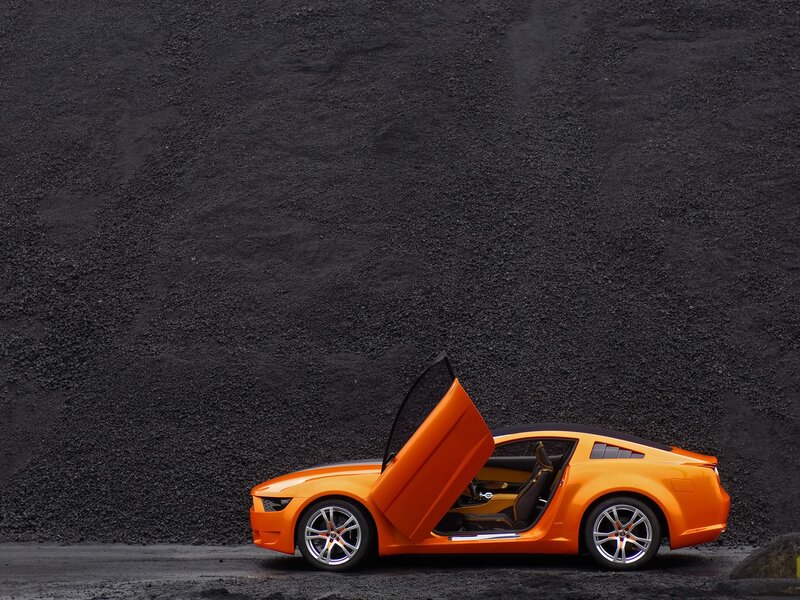 Orange sports car with open door