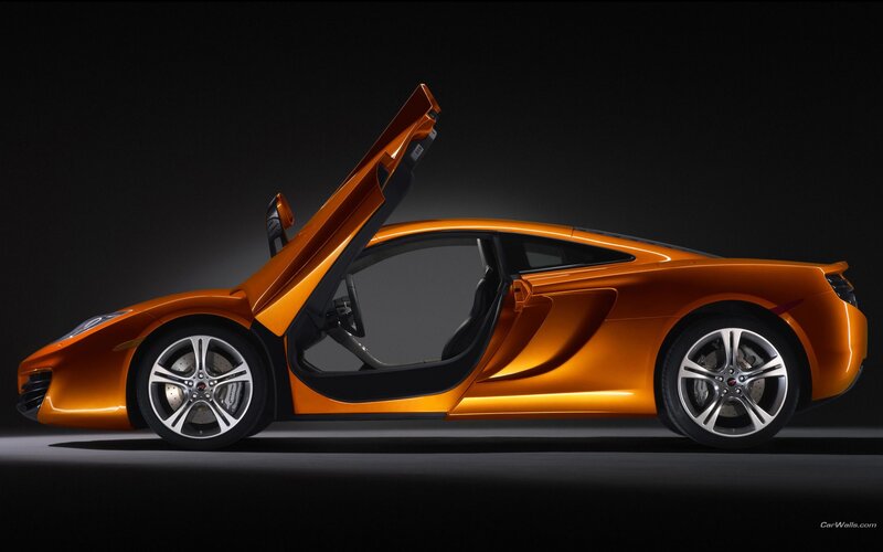 orange sports car with open door