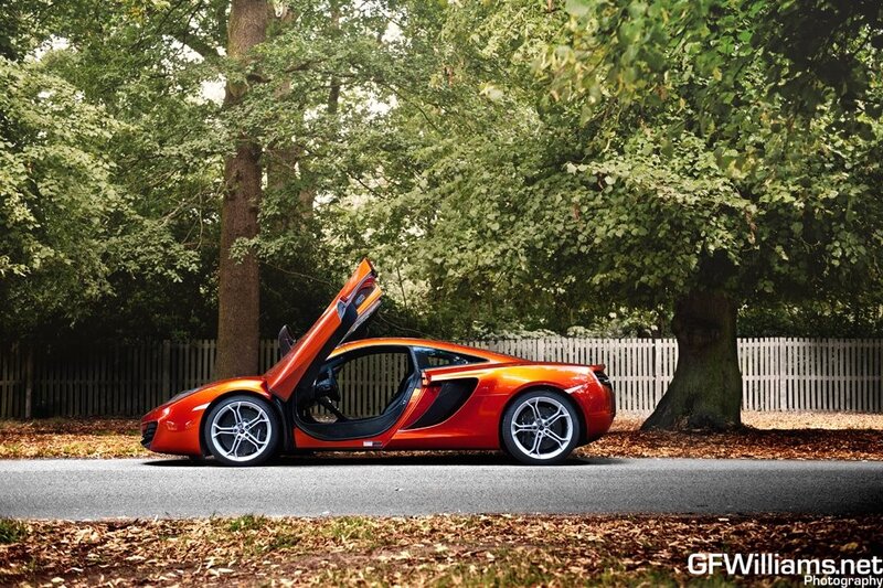 orange sports car with open door