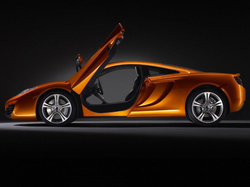 orange sports car with open door