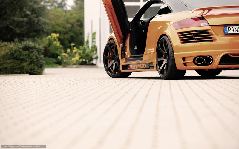 orange sports car with open door