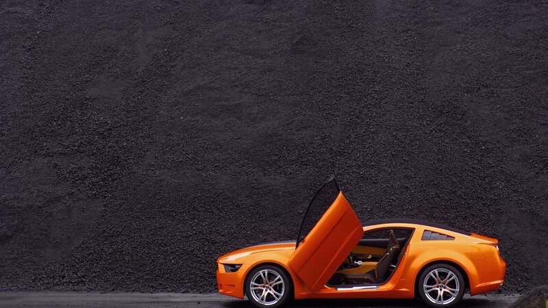 Orange sports car with open door