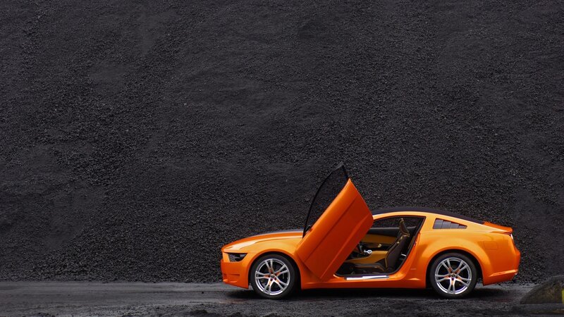 Orange sports car with open door