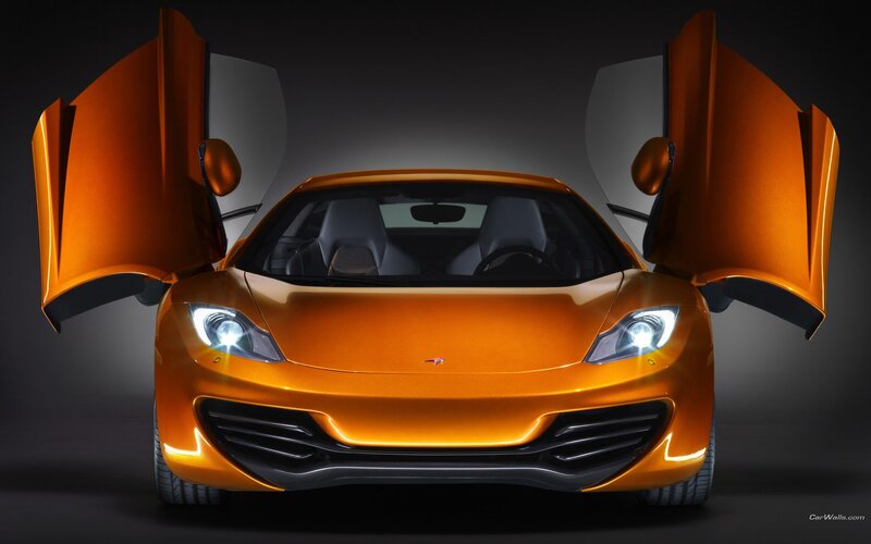 orange sports car with open doors