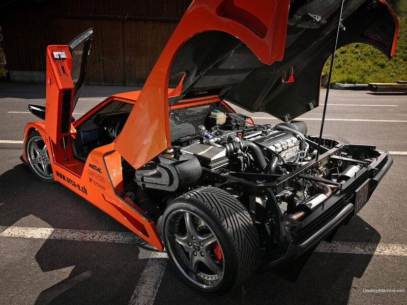 orange sports car with open doors