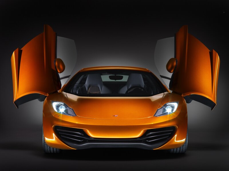 Orange sports car with open doors