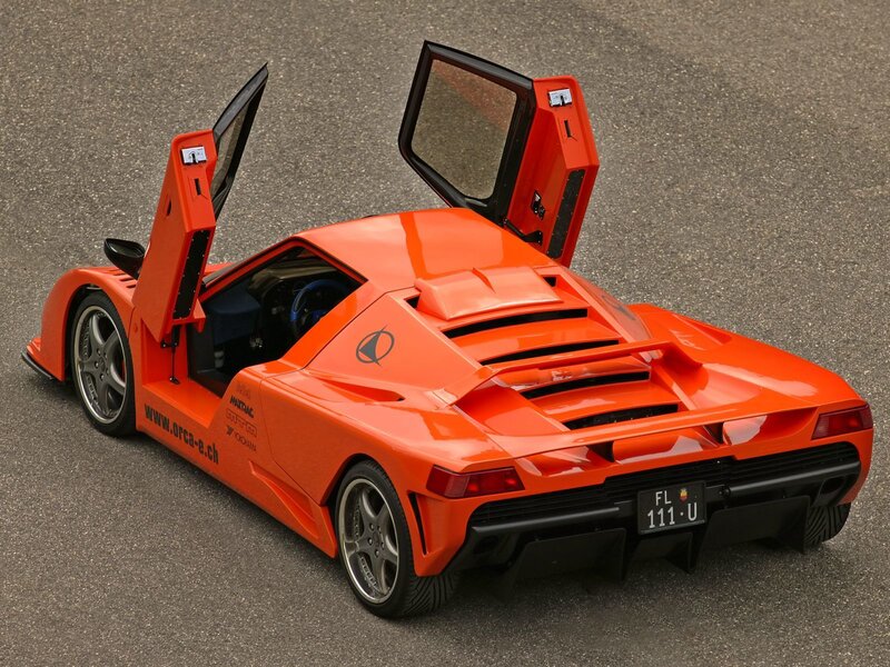 Orange sports car with open doors