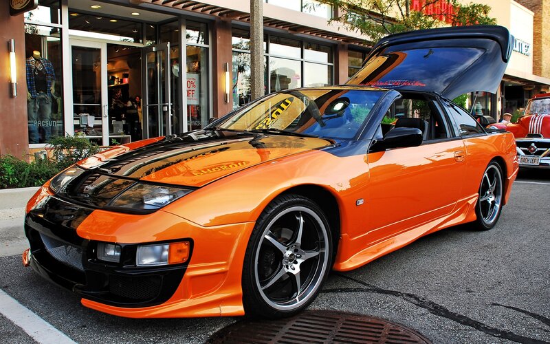 Orange sports car with open hood