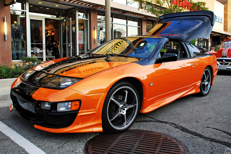 Orange sports car with open hood