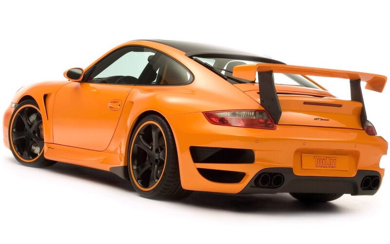 orange sports car with rear wing