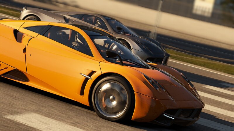 Orange sports cars racing