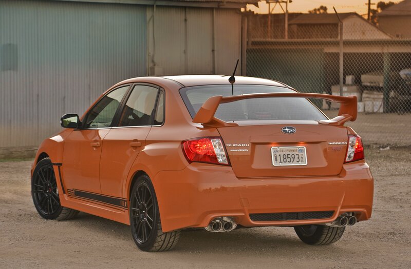 orange subaru impreza sti