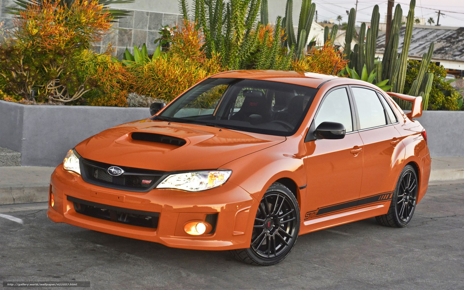 orange subaru wrx sti sedan