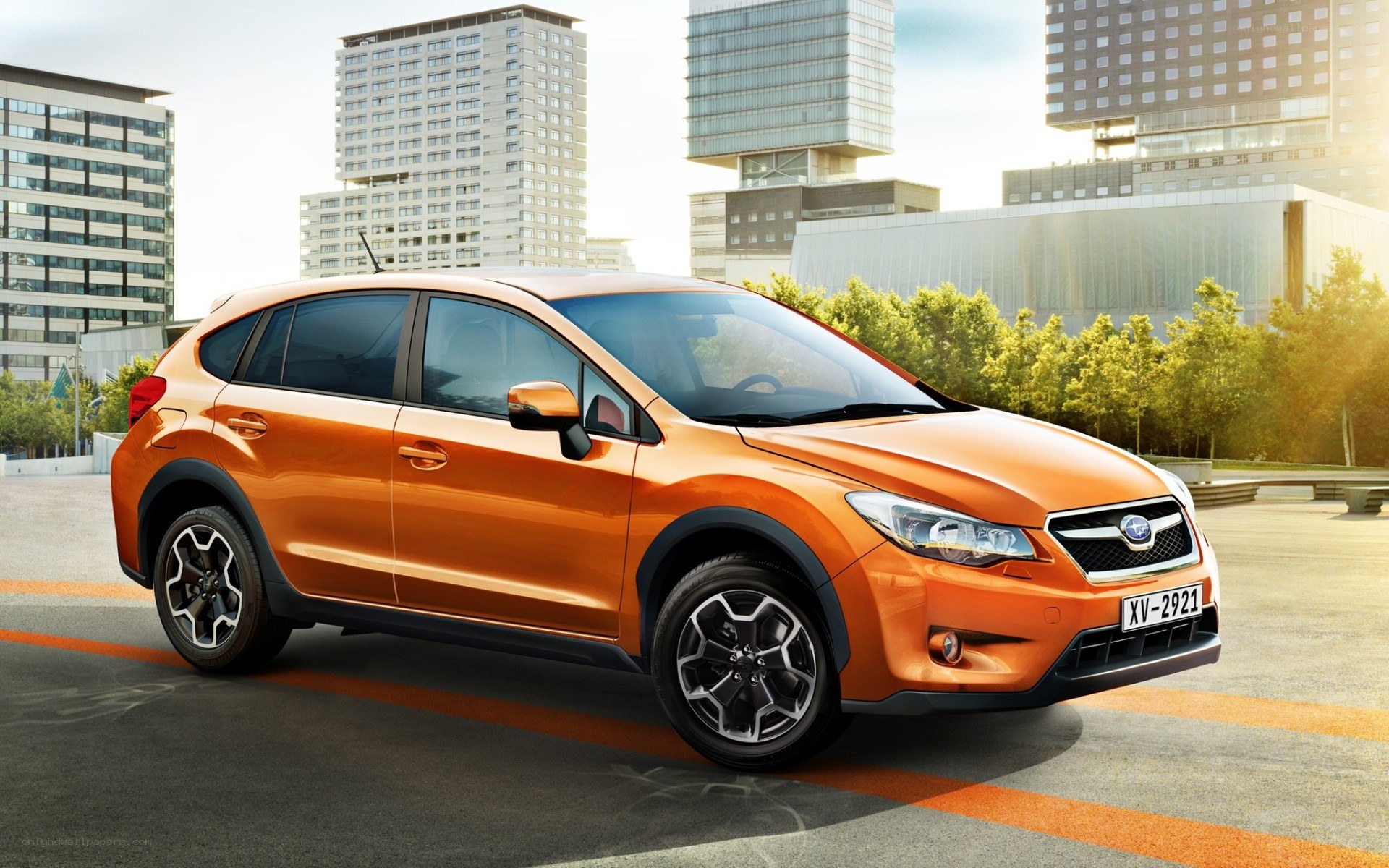 Orange Subaru XV in city