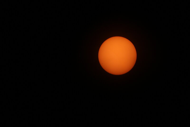 Orange Sun in Dark Sky