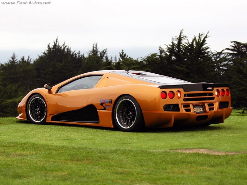 orange supercar on grass