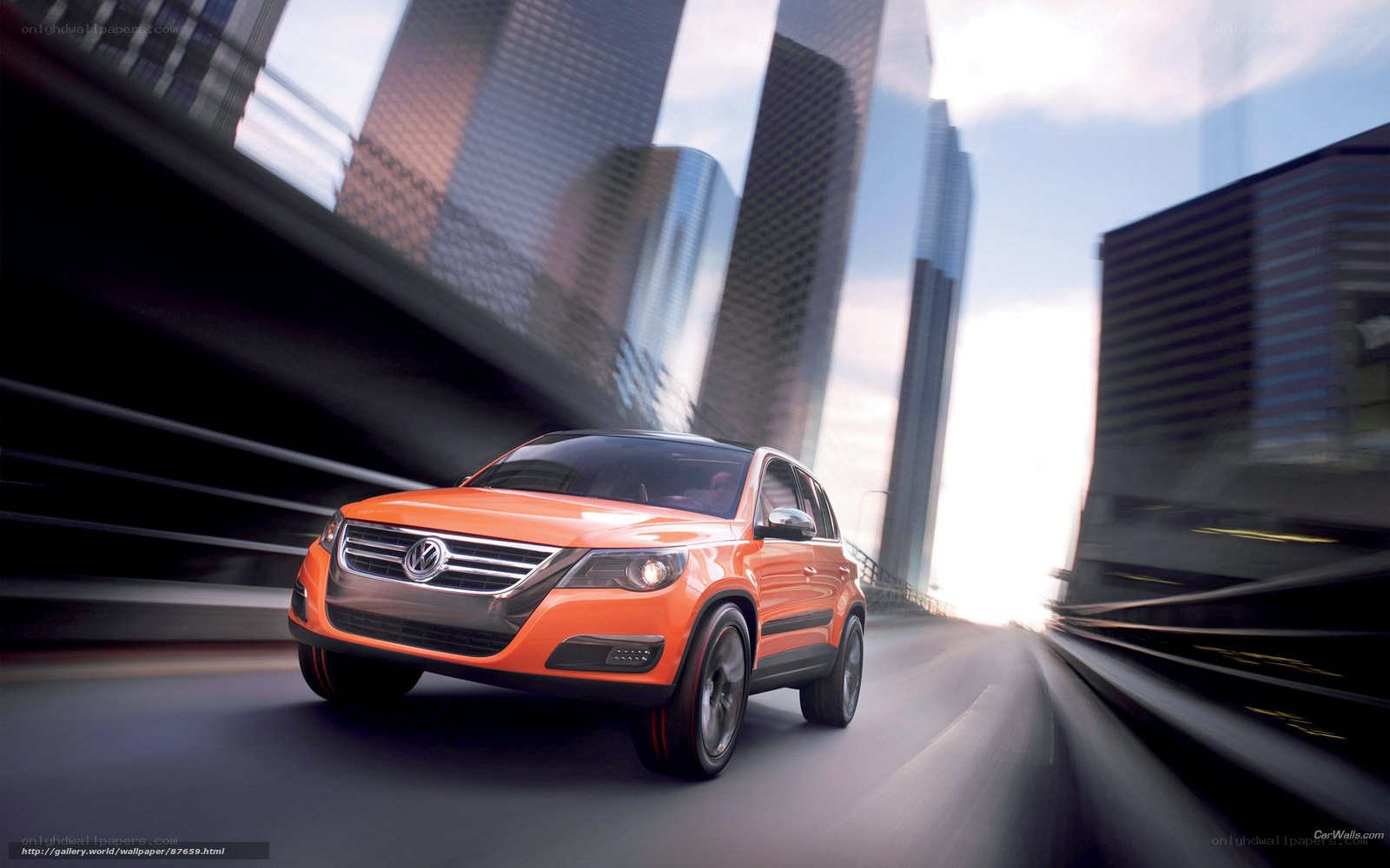 Orange SUV in city motion