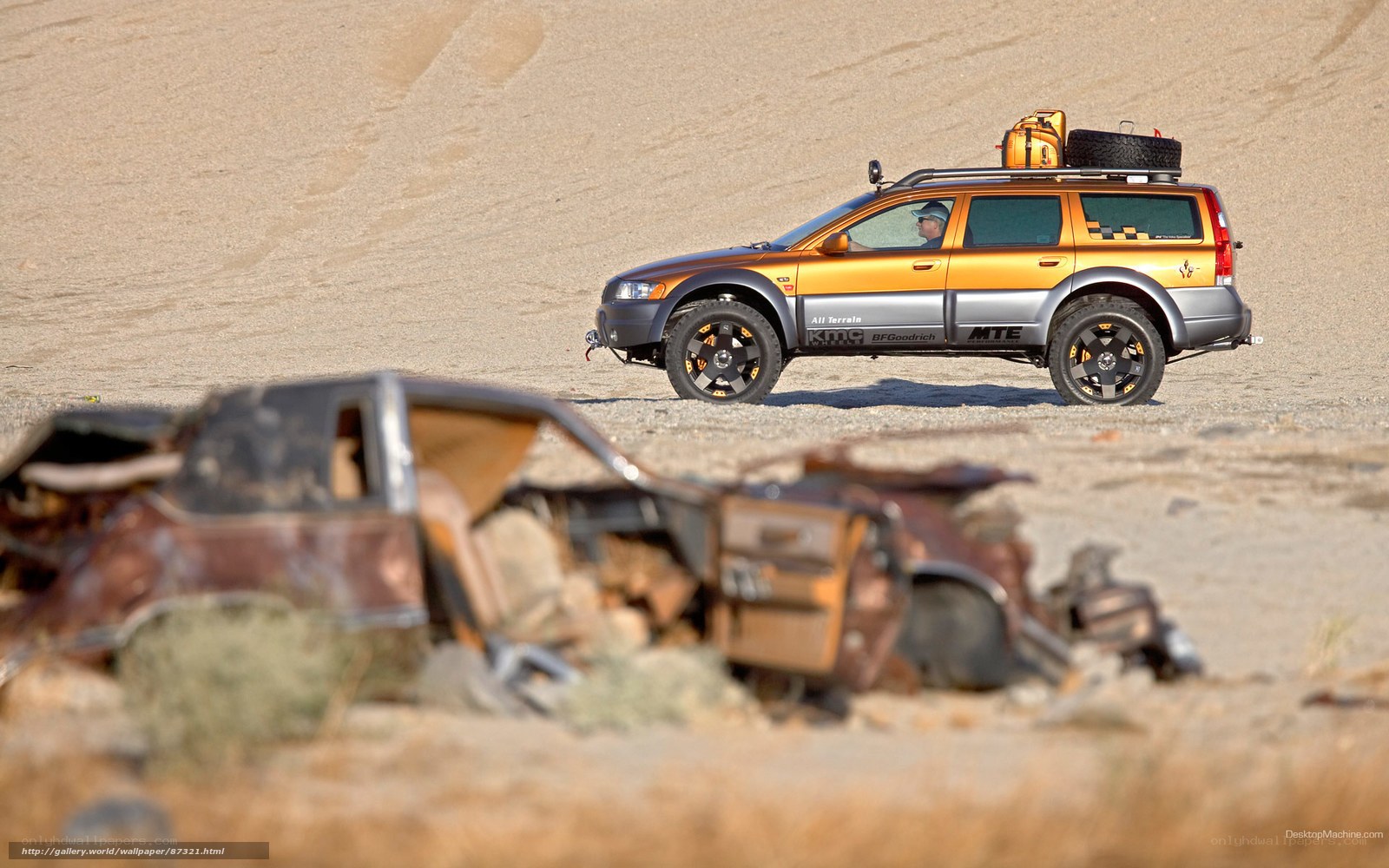 Orange SUV in desert landscape
