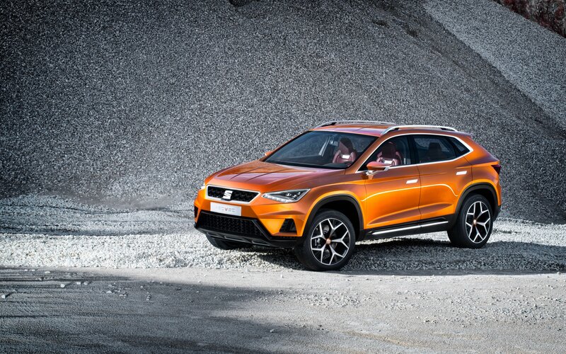 Orange SUV on Gravel