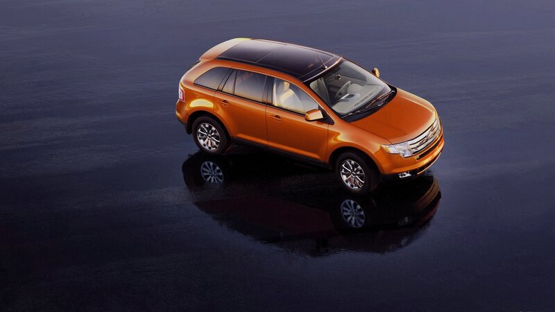 Orange Suv on Wet Surface