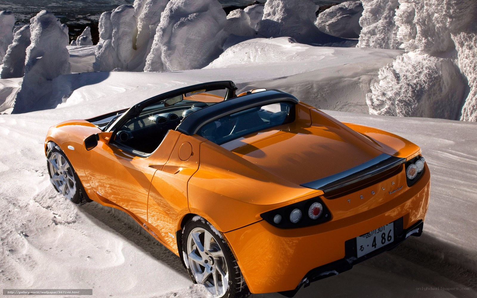 Orange Tesla Roadster in snow