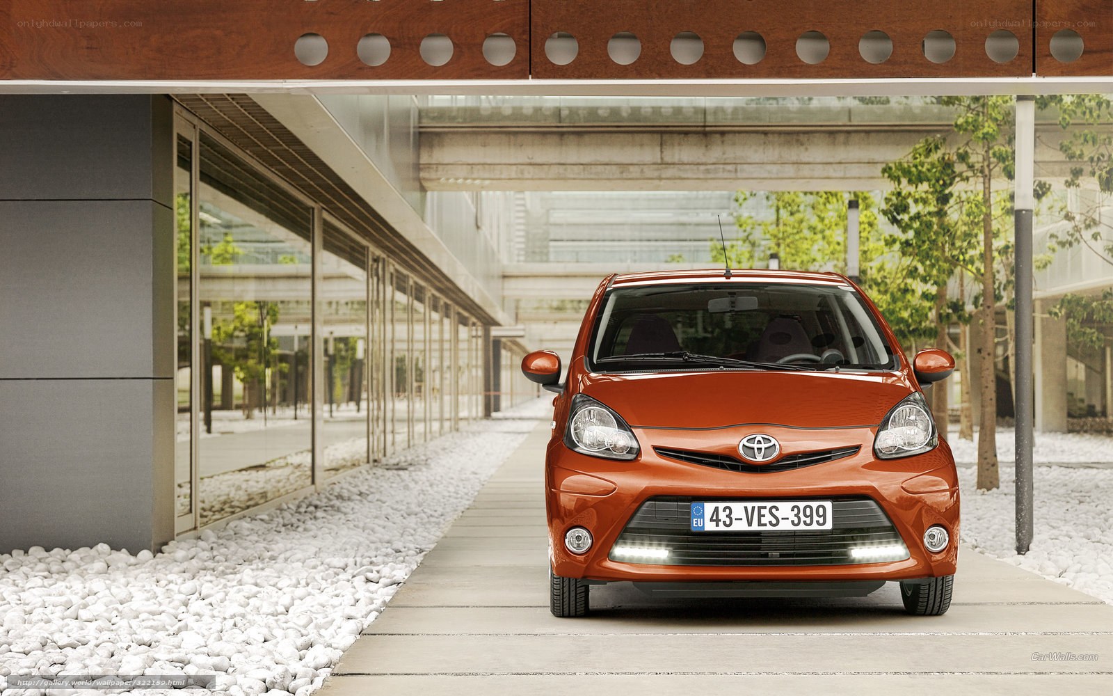 Orange Toyota Aygo parked