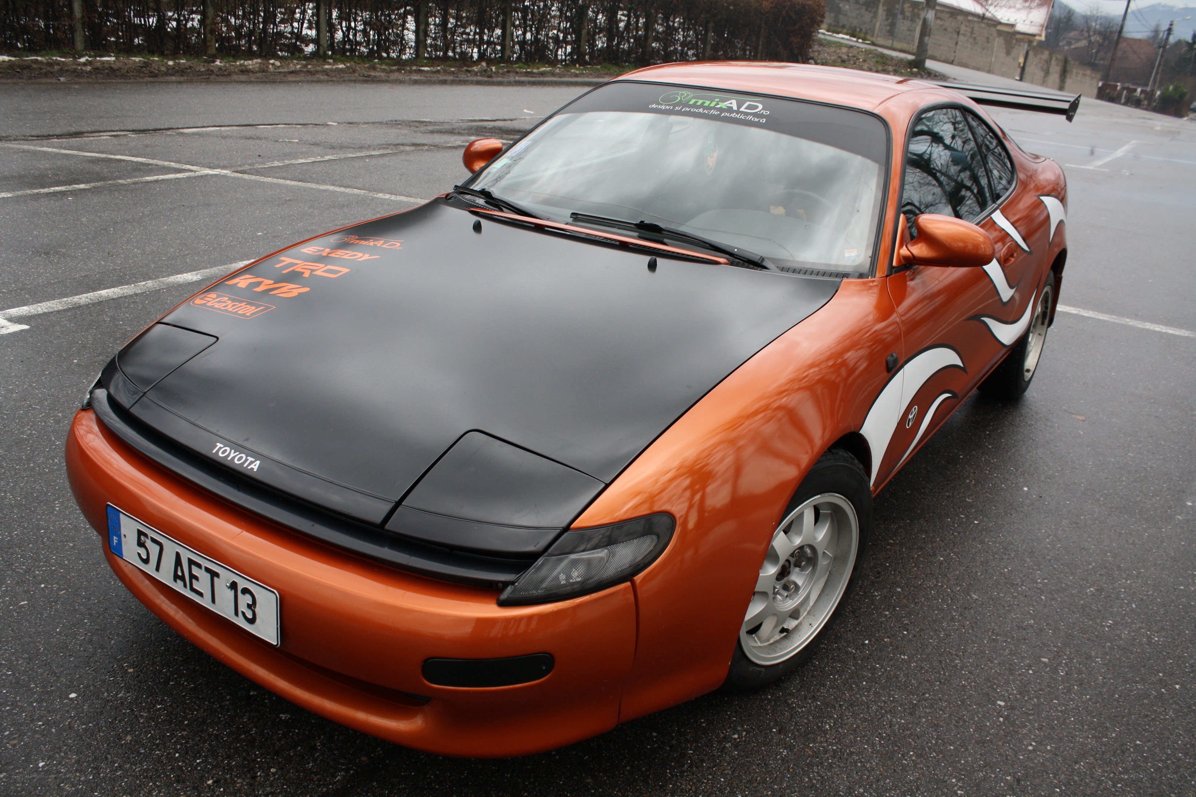 orange toyota celica with decals