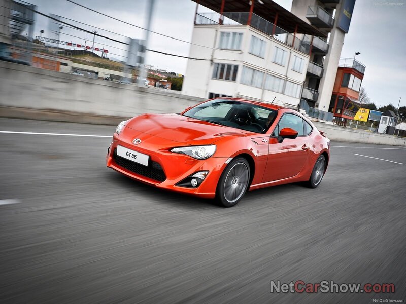 orange toyota gt-86 in motion