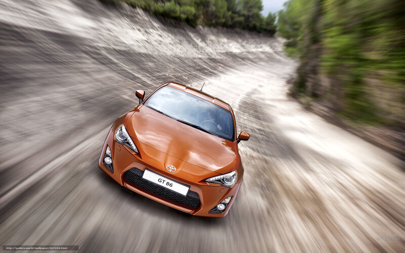 Orange Toyota GT 86 on a winding road