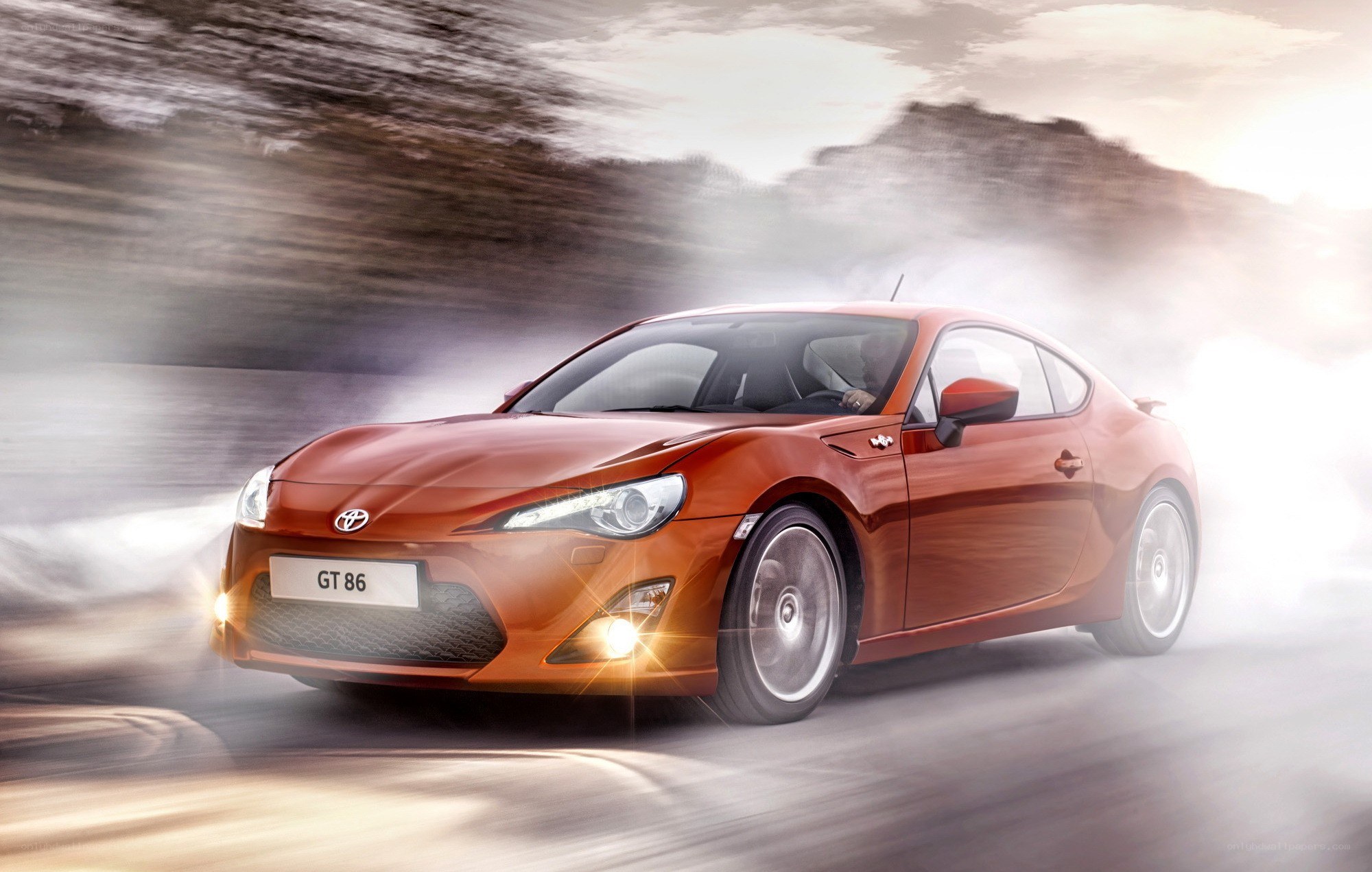 Orange Toyota GT86 in motion