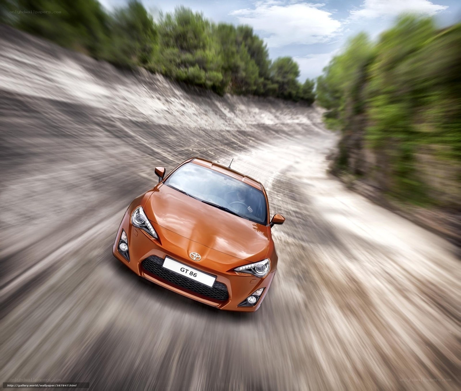 Orange Toyota GT86 on a dirt road