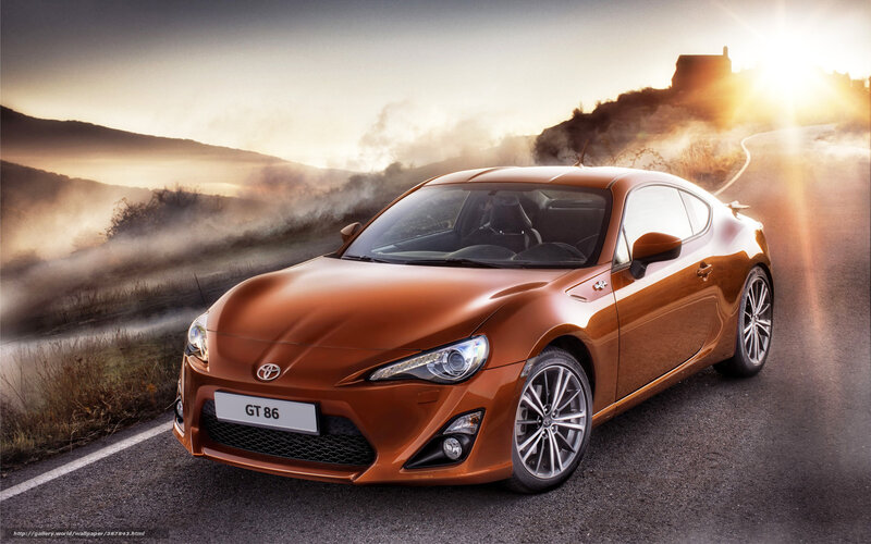 Orange Toyota GT86 on a winding road